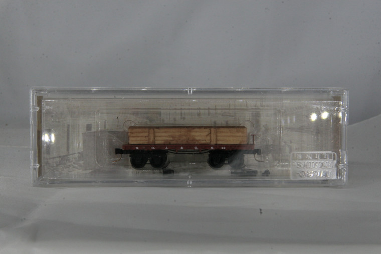 153-50-019 - Micro-Trains N-Scale 26' Civil War Era Flat Car, w/ load, New Orleans, Jackson & Great Northern #42