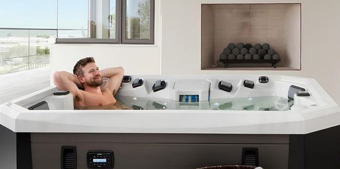 Man Relaxing in a Modern Hot Tub