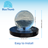 Dimensions - A sleek, acrylic crystal sphere fountain rests on a round black base with water flowing. Measurements indicate a 24-inch diameter and 22.75-inch height.