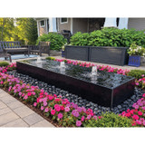 96-inch Acrylic Heiho low-profile triple-plume fountain in a landscaped patio setting