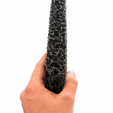 Hand holding black Matala replacement filter mat to demonstrate its thickness and open-weave structure