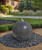 30" Black Granite Sphere installed in a yard