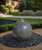 Black Granite Sphere in natural setting