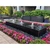 96-inch Acrylic Heiho low-profile triple-plume fountain in a landscaped patio setting
