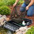Woman lifting a black replacement mesh debris net from a Blue Thumb pond skimmer