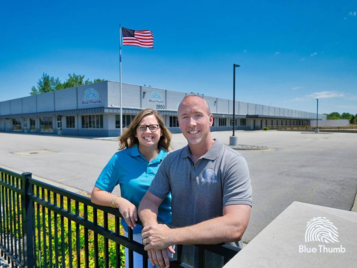 Kip and Nicole outside the Blue Thumb facility