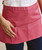 Close-up of pocket detail on Premier PR155 3-Pocket Apron in fuchsia – embroidered service apron