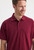 Uneek UC114 men’s active cotton polo shirt in maroon for workwear, collar detail
