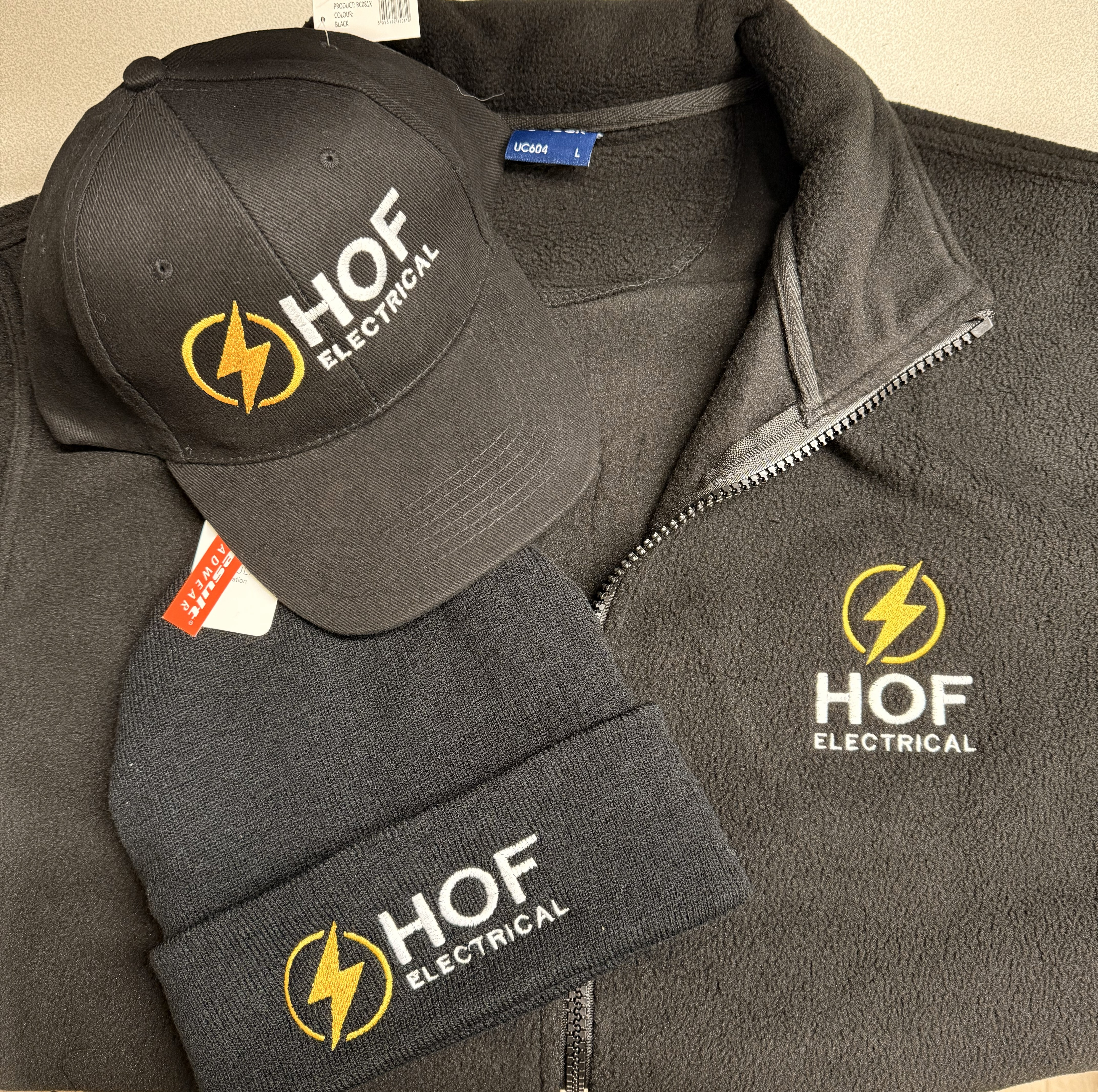 Embroidered workwear including fleece, cap and beanie with company logo