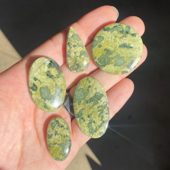 50g Parcel of Canadian jade in a hand