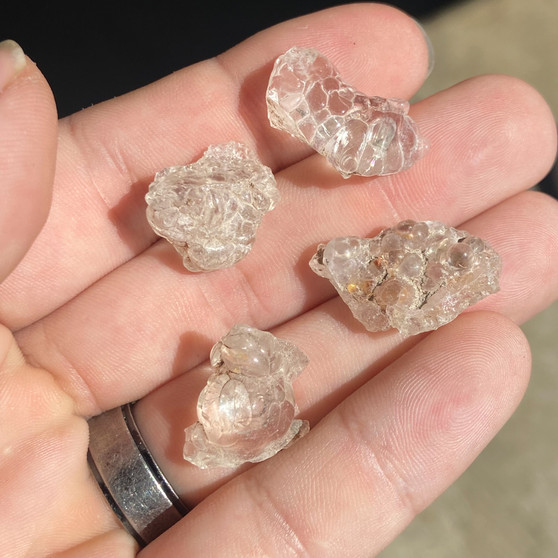 Handful of Hyalite Opal in the daylight