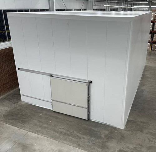 Large white drive-in freezer with sliding door and insulated panel walls