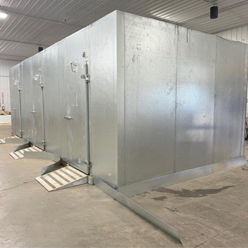 Silver galvanized walk-in freezer with floor exterior front right view.