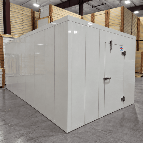 White walk-in cooler unit with closed hinged door, featuring insulated panel walls front left view