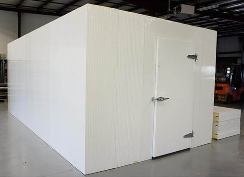 White walk-in cooler unit with closed hinged door, featuring insulated panel walls