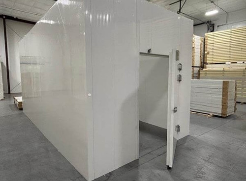 White walk-in cooler unit with open hinged door, showing interior and insulated panel walls