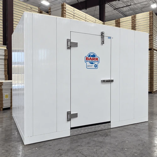White walk-in commercial freezer with an open door revealing a textured floor front left view