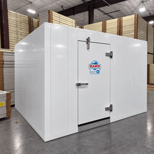 White walk-in commercial freezer with closed door