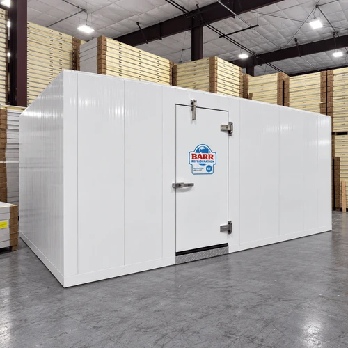 White walk-in commercial freezer with closed door