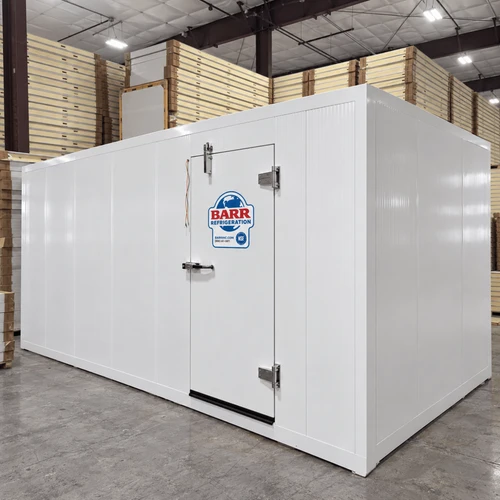 White walk-in commercial freezer with ceiling panels next to it
