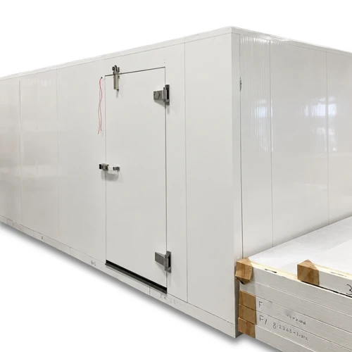 White walk-in commercial freezer with ceiling panels next to it