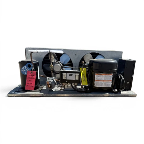 Straight-on front view of the used Tecumseh AKA9478ZXAXC 0.75 HP condensing unit #625, showing the compressor, blue inventory tag #625, and twin condenser fans.