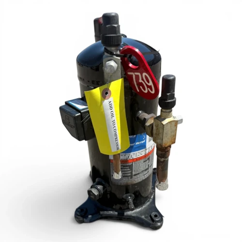 Front-left view of a used Copeland ZS21K4E-TF5 3 HP scroll compressor, 3 phase 208-230 volt, showing the valve manifold, foil-wrapped copper line, and "See Nameplate For Oil Type" sticker.