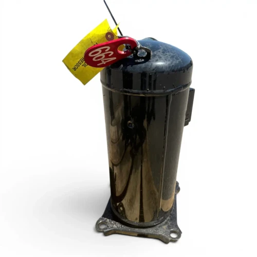 Back view of the used Copeland ZP50K3E-PFV 4 HP scroll compressor #664 (1 phase, 208-230 volt), showing a red round inventory tag numbered "664" with a yellow "ADD OIL TO COMPRESSOR" tag hanging from the top, and the smooth black rear shell.