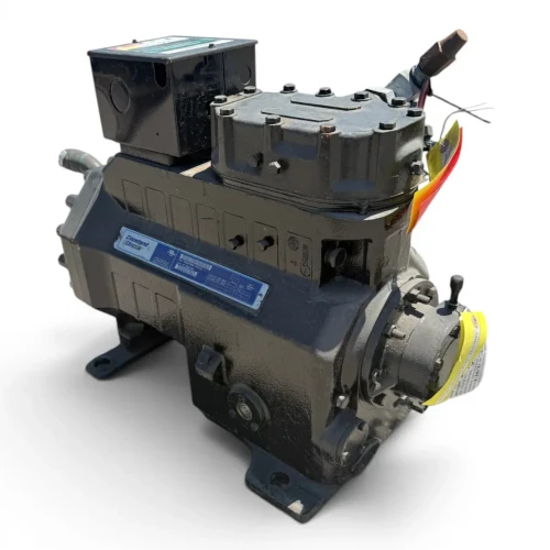 Straight-on front view of the used Copeland 3DA3-R10ML-TFD 7.5 HP compressor, 3 phase 460 volt, with a gray-black housing, blue Copeland Discus nameplate, and a red round inventory tag hanging near the top valve.