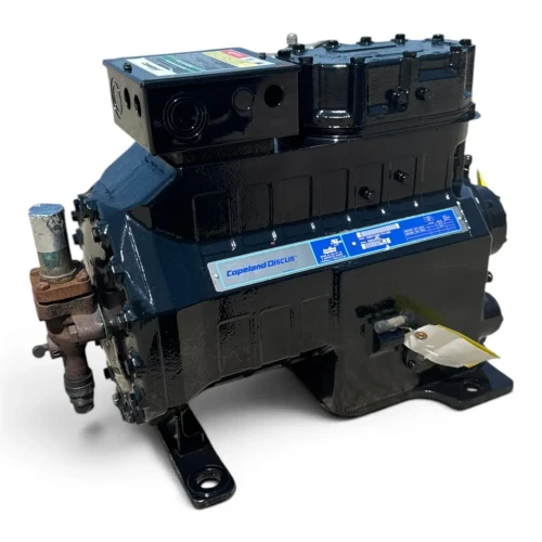 Three-quarter front-right view of a used Copeland 3DB3-F33KE-TFC 7.5 HP compressor, 3 phase 208-230 volt, with a gunmetal-gray housing, blue Copeland Discus nameplate, and a red round inventory tag hanging from the top valve.