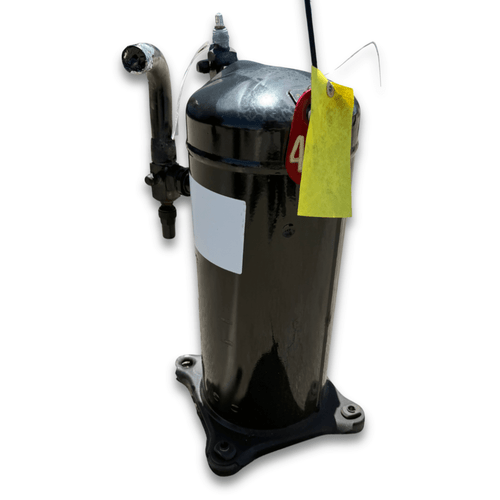 Multiple refrigeration compressors of varying sizes and various manufacturer labels