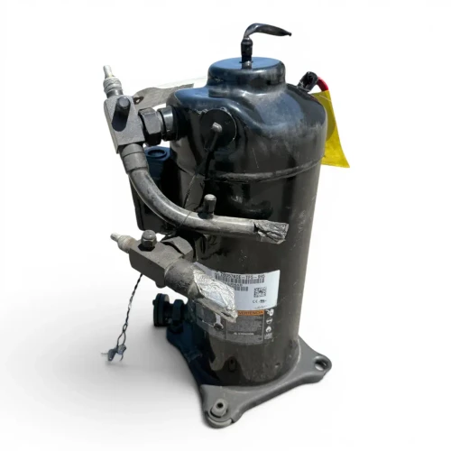 Front view of the used Copeland ZBD57KCE-TF5 7.5 HP digital scroll compressor, 3 phase 208-230 volt, with the folded white paper tag showing handwritten "OIL CHANGED / ROD CHECKED / FANS IF APPLICABLE / DATE / OIL SAFETY CONTROL" notes and dangling wire crimp connectors near the base.