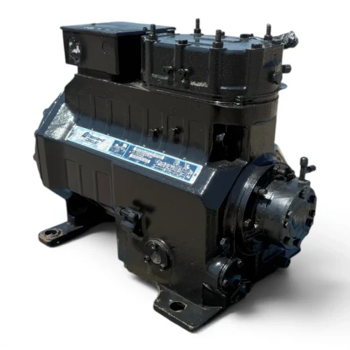 Three-quarter rear view of the used Copeland 3DB3-F33KE-TFD 7.5 HP Copelametic compressor, 3 phase 460 volt, showing the cylindrical crankcase, the blue Copeland Discus nameplate, and the drive shaft end with mounting bolts.