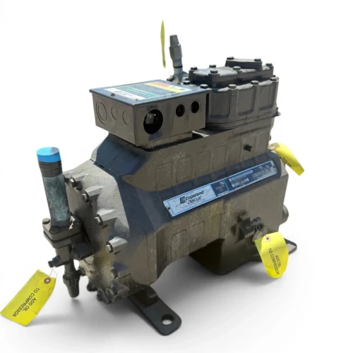 Front-left three-quarter view of the used Copeland 3DK3A-120E-TFC 12 HP compressor, showing the same blue-capped copper stub and "Copeland Discus" nameplate along with multiple yellow "Add Oil to Compressor" tags hanging from the terminal box, foot, and end bell.