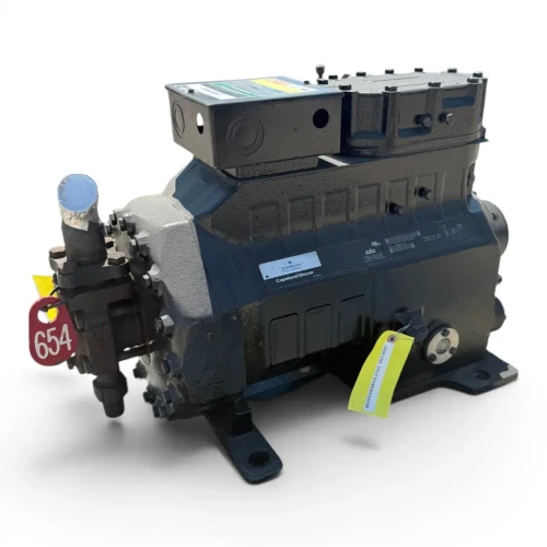 Front view of the used Copeland 3DS3-R17KE-TFC 15 HP compressor, showing the "Emerson Copeland Discus" nameplate with model and serial data, the same red "654" tag, and a yellow "Add Oil to Compressor" tag hanging near the shaft-end cap.