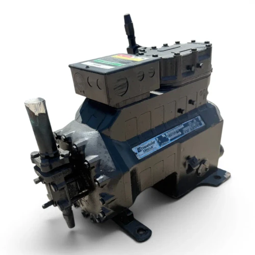 Front-left three-quarter view of a used Copeland 3DS3A-150L-TFC 15 HP compressor (3 phase 208-230 volt), olive-gray semi-hermetic housing with the "Copeland Discus" nameplate, a foil-wrapped copper suction stub at upper left, and an angled discharge fitting at the top.
