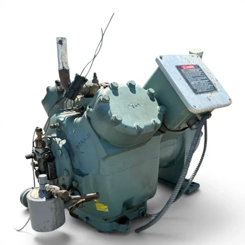 Front-right three-quarter view of the used Carlyle 06EZ450-370 15 HP compressor (3 phase Dual Voltage), with a red round inventory tag numbered "35" hanging near the valve fitting and the weathered silver DANGER terminal box facing the camera.