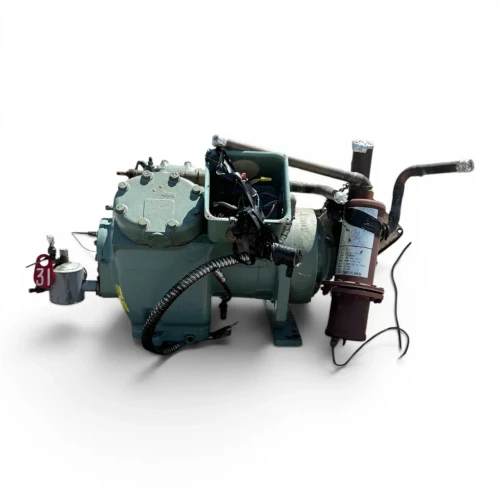 Front-left angled view of the used Carlyle 06EZ750-37ARP 15 HP compressor (3 phase Dual Voltage), showing an open terminal box with a tangle of colored control wires, a blue oil-safety switch canister labeled "S-9130," a red round tag numbered "31," and a rust-stained coupling flange with a foil-wrapped stub at the right.
Photo