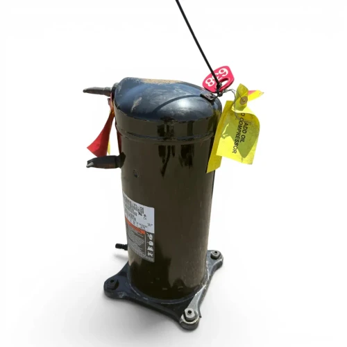 Front view of a used Copeland ZS38K4E-TF5 5 HP scroll compressor, 3 phase 208-230 volt, showing a red oval tag and yellow "Add Oil To Compressor" tag near the top ports, with the terminal box on the right side.