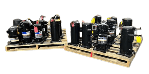 Multiple refrigeration compressors of varying sizes and various manufacturer labels