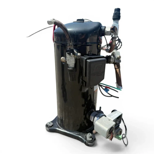 Front-right view of a used Copeland ZF18KVE-TF5 6 HP scroll compressor (3 phase 208-230 volt), showing the terminal box, exposed red, blue, and green control wiring, and an Emerson oil-management alarm module wired at the base.