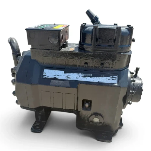 Three-quarter front-left view of a cleaner used Copeland 2DA3-R89KE-TFC 7.5 HP compressor, 3 phase 208-230 volt, with a gray-black housing, blue Copeland Discus nameplate, and a red round inventory tag hanging from the top valve.