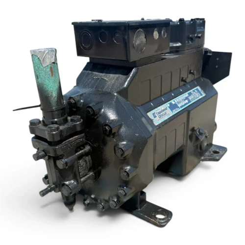 Front-right three-quarter view of the used Copeland 3DS3A-150L-TFC 15 HP compressor, showing the same green foil-tipped copper line from a mirrored angle and the full nameplate with model and rating table.