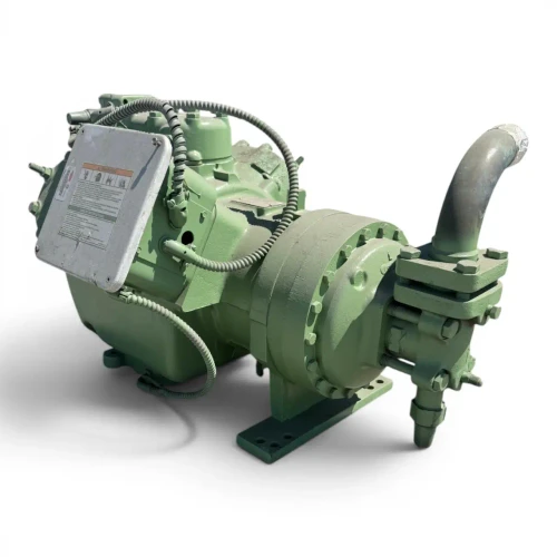 Angled front-left view of the used Carlyle 06EY775-34ARP 20 HP compressor, 3 phase Dual Voltage, showing the silver "Warning" terminal box cover, the mounting foot bracket, and a foil-wrapped elbow fitting on the right-side valve.