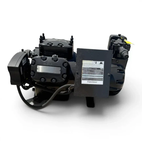 Angled front-right view of the used Copeland 6DJN-F11ME-TSK 30 HP compressor, 3 phase Dual Voltage, black finish, showing the gray Copeland Danger terminal box, a yellow "Add Oil to Compressor" tag on the right valve, and coiled wiring conduit on the left.