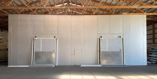 Large white walk-in cooler with two sliding doors