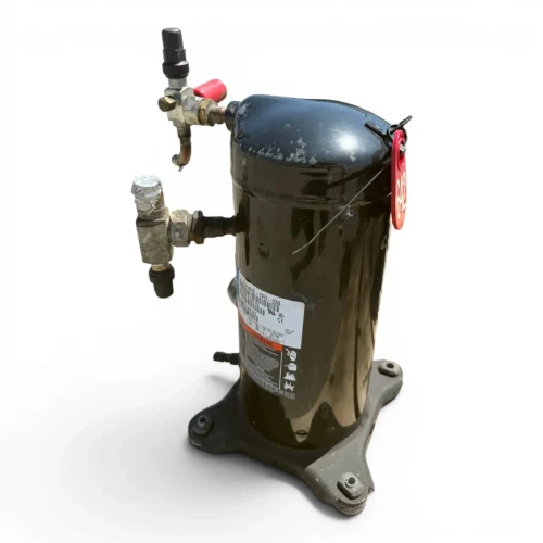 Front view of the used Copeland ZS21K4E-TFD 3 HP scroll compressor (3 phase, 460 volt) with a white "COMPRESSOR #1" label on the dome, the blue Copeland nameplate, a "SEE NAMEPLATE FOR OIL TYPE" sticker, and an ALCO TRAXOIL oil-level control module with colored wire leads mounted at the base.