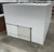 Large white drive-in cooler with sliding door and insulated panel walls