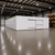 Large white drive-in cooler with sliding door and insulated panel walls