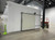 Large white drive-in freezer with sliding door and insulated panel walls
